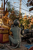 Vientiane, Laos - Pha That Luang, various Buddha statues among the Other structures on the ground. 